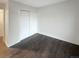 Simple bedroom with hardwood floors and a double door closet at 4635 Sable St, Denver, CO 80239
