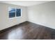 Spacious bedroom with hardwood floors and a window at 4635 Sable St, Denver, CO 80239