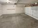 Attached garage with an automatic door opener and concrete floor at 4635 Sable St, Denver, CO 80239