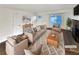 Virtually staged living room featuring neutral tones and fireplace at 4635 Sable St, Denver, CO 80239