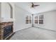 Spacious living room with a fireplace and large windows at 7135 Leopard Dr, Lone Tree, CO 80124