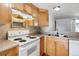 Well-equipped kitchen with light wood cabinets and a double sink at 336 N Grant St # 409, Denver, CO 80203