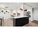 Open concept kitchen with island and stainless steel appliances at 3131 E Alameda Ave # 1107, Denver, CO 80209