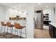Modern kitchen features stainless steel appliances and a breakfast bar at 3131 E Alameda Ave # 1107, Denver, CO 80209