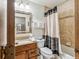 Clean bathroom with tub shower combo, granite vanity, and updated tile at 100 S Park Ave # 111112, Breckenridge, CO 80424