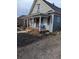Two-story house with front porch and landscaping at 305 Strong St, Brighton, CO 80601