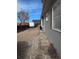 Gravel driveway and backyard with shed at 305 Strong St, Brighton, CO 80601