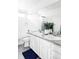 Double vanity bathroom with white cabinets and grey countertop at 10925 Wheeling St, Commerce City, CO 80022