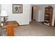 Finished basement area with built-in shelves and an open floor plan at 4062 S Rifle Way, Aurora, CO 80013