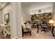 Home office with built-in shelving and comfortable seating at 11874 Barrentine Loop, Parker, CO 80138