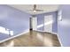 Light purple walls and hardwood floors in this bedroom at 5442 S Cedar St, Littleton, CO 80120