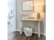 Stylish entryway with console table and woven basket at 3521 Mykonos Dr, Castle Rock, CO 80109