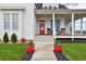 Inviting front porch with rocking chairs at 6261 County Road 41, Fort Lupton, CO 80621