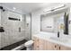 Contemporary bathroom with a walk-in shower and light wood vanity at 1736 W 39Th Ave, Denver, CO 80211