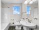 Clean bathroom featuring a sink, toilet and bathtub at 54686 E Bobcat Ln, Strasburg, CO 80136