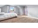 Charming bedroom with window seating and neutral decor at 54686 E Bobcat Ln, Strasburg, CO 80136