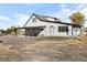 Rear view of house with carport and rural setting at 54686 E Bobcat Ln, Strasburg, CO 80136