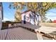 Wooden deck with bench seating, overlooking yard at 54686 E Bobcat Ln, Strasburg, CO 80136