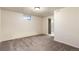 Bright and airy basement bedroom with carpet and access to full bathroom at 54686 E Bobcat Ln, Strasburg, CO 80136