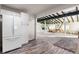 Modern kitchen with white cabinets, stainless steel appliances, and granite countertops at 54686 E Bobcat Ln, Strasburg, CO 80136