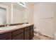 Clean bathroom with double sinks, shower, and tile floor at 25266 E Lake Dr, Aurora, CO 80016