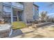 Building entrance with stairs and a yellow-painted landing at 8035 W Eastman Pl # 104, Lakewood, CO 80227