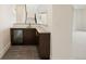 Modern basement wet bar with sleek cabinetry and hexagon tile flooring at 6196 Oxford Peak Ln, Castle Rock, CO 80108