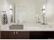 Modern bathroom with floating vanity, quartz countertop, and sleek fixtures at 6196 Oxford Peak Ln, Castle Rock, CO 80108