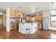 Modern kitchen featuring wood cabinets, stainless steel appliances, and an island at 1570 S County Road 129, Bennett, CO 80102