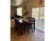 Dining area with wooden table and chairs near sliding doors at 15171 E 118Th Ave, Commerce City, CO 80603