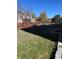 Backyard with a grassy area and a red fence at 15171 E 118Th Ave, Commerce City, CO 80603
