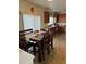 Kitchen dining area with wooden table and chairs at 15171 E 118Th Ave, Commerce City, CO 80603