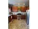 Spacious kitchen with wood cabinets, granite counters and stainless steel appliances at 15171 E 118Th Ave, Commerce City, CO 80603