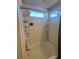 Bright bathroom with shower/tub and built-in shelving at 15171 E 118Th Ave, Commerce City, CO 80603