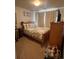 Cozy bedroom with double bed and wood dresser at 15171 E 118Th Ave, Commerce City, CO 80603