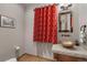 Powder room with copper sink and decorative red curtain at 312 Corkscrew Dr, Breckenridge, CO 80424