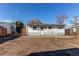 House back view, showing patio and yard space at 6930 Birch St, Commerce City, CO 80022