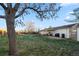 Large backyard with grassy area, shed, and patio at 272 Helena Cir, Lone Tree, CO 80124