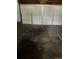 Garage with off-white door and stained concrete floor at 420 E 45Th Ave, Denver, CO 80216