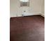 Simple bedroom with brown carpet, window, and air conditioning unit at 420 E 45Th Ave, Denver, CO 80216