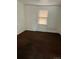 Simple bedroom with brown carpet and window at 420 E 45Th Ave, Denver, CO 80216