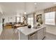 Modern kitchen with island, looking toward dining area at 43195 Merion Hills Ct, Elizabeth, CO 80107