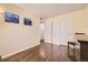 Hardwood floor bedroom with double door closet and built-in dresser at 6890 W Mississippi Ave # D, Lakewood, CO 80226