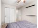 Spacious bedroom with double door closet and ceiling fan at 5104 S Jebel St, Centennial, CO 80015