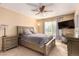 Spacious bedroom with a ceiling fan and large window at 5104 S Jebel St, Centennial, CO 80015