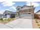 Two-story house with stone accents and a two-car garage at 1821 Water Birch Way, Castle Rock, CO 80108