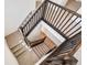 Modern staircase with dark wood railing and carpeted steps at 1821 Water Birch Way, Castle Rock, CO 80108