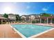 Inviting community pool with lounge chairs and pergola at 9481 E Mansfield Ave # 305, Aurora, CO 80014