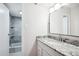 Updated bathroom with granite countertop and tiled shower at 4801 E 9Th Ave # 405S, Denver, CO 80220