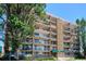 Exterior view of apartment building with trees at 4801 E 9Th Ave # 405S, Denver, CO 80220